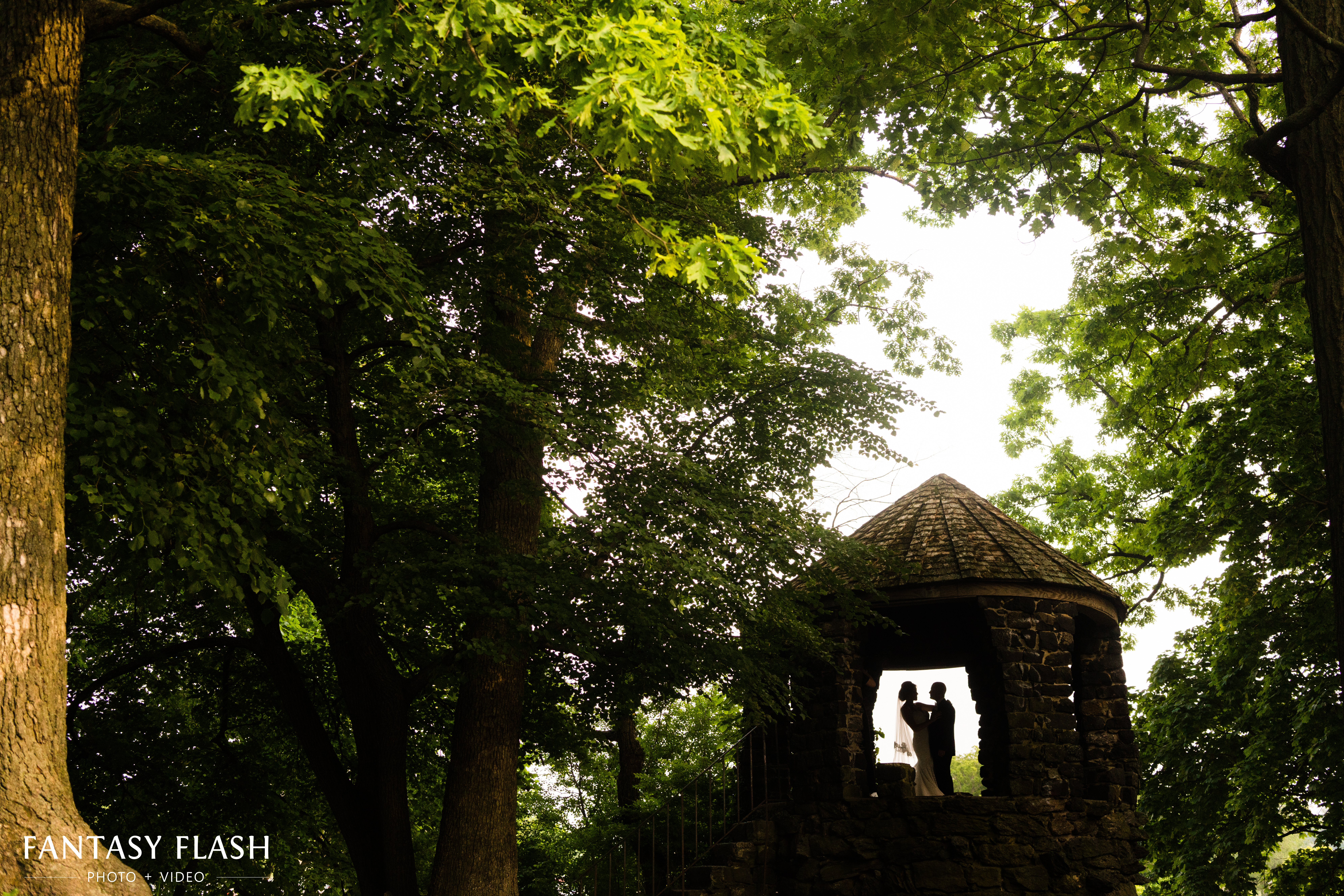 Wedding photo of bride and groom in stone castle at glen island park