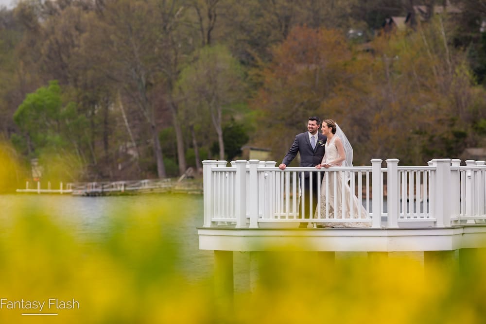 bride and groom on the candlewood inn dock
