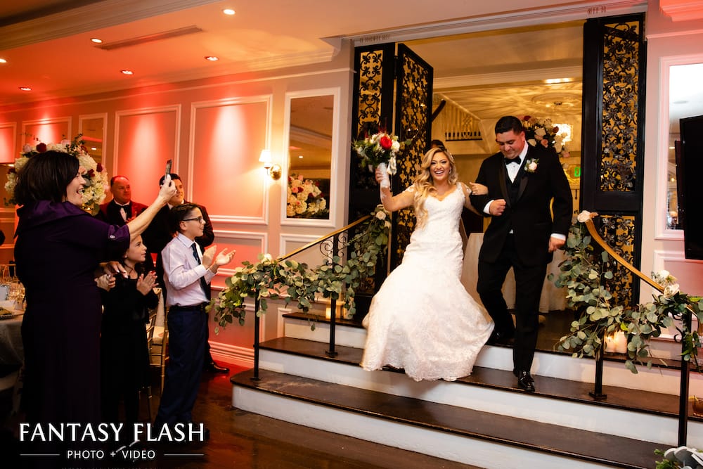 a bride and groom entering their wedding reception at The Briarcliff Manor