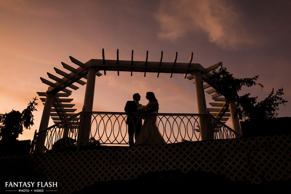 A bride and groom on the gazebo at VIP Country Club
